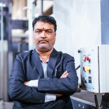 Business, India, Factory - Factory Manager Standing Hand Clasped and Looking at the Camera for a Portrait